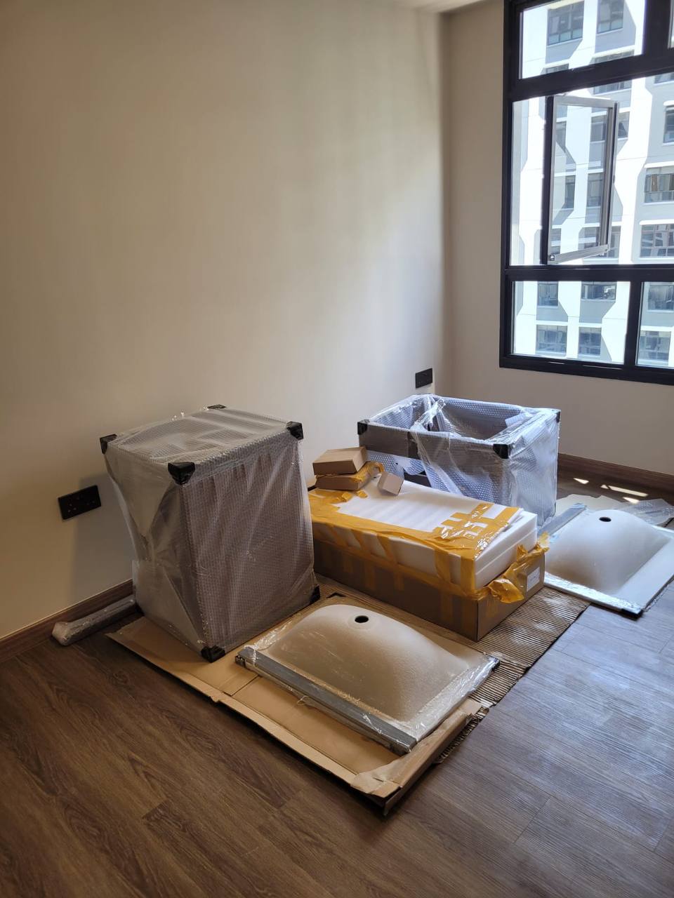 Bathroom fixtures and renovation materials staged on site before installation